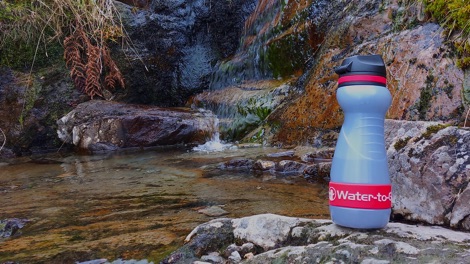 Water-to-Go filter bottle near waterfall